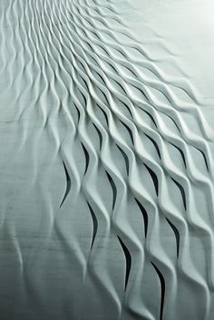 an abstract photo of wavy lines in white and black