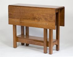 a small wooden table with two drawers on one side and an open drawer on the other