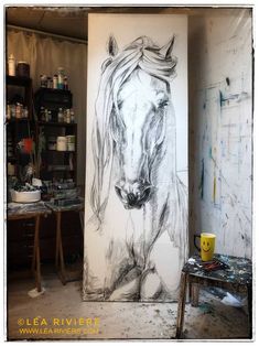 a drawing of a horse is on the wall