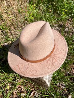 A daisy design on an adjustable wide brim fedora. Each hat is burned by hand. Fits a size 7-7 1/2. Shipping is included in the price. Brimmed Felt Hat For Outdoor Spring Activities, Spring Brimmed Felt Hat For Outdoor, Spring Outdoor Brimmed Felt Hat, Adjustable Fedora For Spring, Spring Outdoor Fedora With Curved Brim, Wide Brim Fedora For Outdoor Spring Activities, Spring Outdoor Felt Hat With Curved Brim, Spring Outdoor Wide Brim Felt Hat, Spring Outdoor Fedora With Short Brim