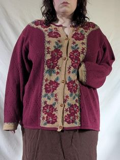 A vintage hand-embroidered Jantzen cardigan with cascading flowers in autumnal shades of red, orange, and green. No material tag,  but feels like a likely cotton ramie blend (and this tracks with similar sweaters from this brand from the same time period). No size tag, but fits like a 2X/3X.  PTP: 27" Length, from shoulder: 28" Vintage Floral Print Cardigan For Fall, Fall Vintage Floral Print Cardigan, Red Vintage Outerwear With Floral Embroidery, Vintage Red Outerwear With Floral Embroidery, Vintage Embroidered Cardigan For Fall, Fall Vintage Embroidered Cardigan, Embroidered Red Cardigan For Fall, Red Embroidered Fall Cardigan, Cascading Flowers