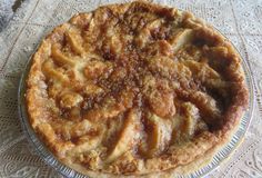 a pie sitting on top of a glass plate