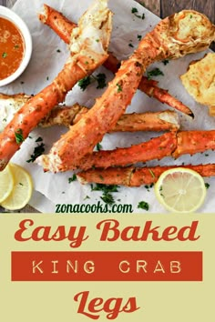 king crab legs with dipping sauce and lemon wedges on the side, in front of them