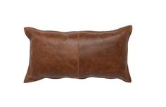 a brown leather pillow on a white background