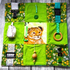 a close up of a bag on a wooden surface with beads and other items around it