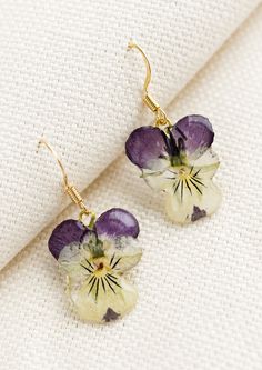 A pair of earrings made from dried viola flowers. Botanical Style Drop Earrings With Pressed Flowers, Botanical Drop Earrings With Pressed Flowers, Botanical Pressed Flowers Drop Earrings, Resin Flower Jewelry, Dried Flower Earrings, Dried And Pressed Flowers, Resin Flowers, Small Pouches, Earring Sale