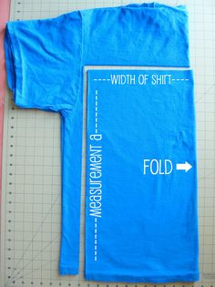 a blue t - shirt with the words, width and length on it next to a ruler