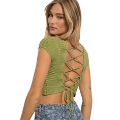 Lace up and go in this fabulous crochet cropped top. Color is pistachio goodness. Details include cap sleeves, square neckline and criss cross back tie so you can adjust the fit to your liking. Pair with your favorite shorts, jeans, or skirt. Details Square neckline Cap sleeves Crochet knit material Criss cross back tie closure Generous stretch in material 100% acrylic Imported Model: 5'9" tall Measures: 34" | 24" |34" model is wearing size small. Care: Hand wash cold water. Do not bleach. Lay f Green Cropped Crochet Top For Spring, Green Fitted Cropped Crochet Top, Fitted Green Cropped Crochet Top, Fitted Green Crochet Top Casual Style, Green Fitted Crochet Top For Casual Wear, Crochet Cropped Top, Crochet Crop Top, Shorts Jeans, Knit Crop Top