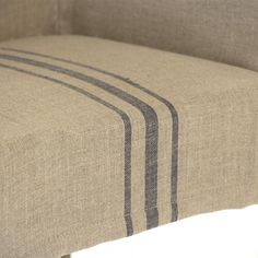 an upholstered bench with stripes on it