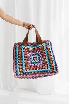 This stunning weekend bag is the perfect blend of craftsmanship and elegance. Featuring a large hand-crocheted design and a soft cotton lining, it offers both style and comfort for everyday use. 🌱 This beautiful bag features: Handmade: Each bag is meticulously and lovingly handcrafted. Crocheted Design:Elegant and durable hand-crocheted pattern. Linen Lining:Soft and durable linen lining to protect your belongings. Leather Strap: Sturdy leather straps complete the bag's chic look. Versatile Use Multicolor Crochet Bag For Travel, Multicolor Crochet Tote Bag With Handles, Multicolor Double Handle Crochet Bag With Large Capacity, Colorful Crochet Tote Bag For Travel, Multicolor Crochet Travel Bag With Large Capacity, Multicolor Crochet Tote Bag For Travel, Multicolor Crochet Tote Bag With Braided Handles, Multicolor Large Capacity Crochet Travel Bag, Large Capacity Multicolor Crochet Travel Bag