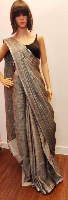 Linen sarees are always in demand.This handwoven gray linen saree give you a unique style.The color is so vibrant that you are going to love it.It comes with a very narrow border,that makes it different.Linen sarees are breathable,light weight and easy to drape. Fabric: Linen by linen  Thread count:100 count Saree Color: Gray Occasion: Casual/Formal Saree length:5.50 mtr Blouse:80 cm Custom Stitching: Available upon request Saree Embroidery: Available upon request Blouse Stitching: Available upo Traditional Linen Saree With Zari Work, Linen Saree With Pallu, Festive Linen Saree With Pallu Detail, Festive Linen Saree With Zari Weaving, Festive Handloom Linen Saree, Wedding Linen Saree With Handloom Detail, Festive Linen Handloom Saree, Traditional Linen Handloom Saree, Drape Fabric