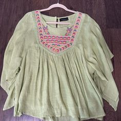 Green Boho Blouse. Size Small. Brand New With Tags. Green Bohemian Top For Summer, Green Bohemian Summer Top, Green Bohemian Tops For Vacation, Green V-neck Tops For Festival, Green Bohemian Top For Day Out, Green Flowy Blouse For Vacation, Green Bohemian Embroidered Top For Spring, Green Bohemian Peasant Top For Vacation, Green Summer Peasant Top For Beach