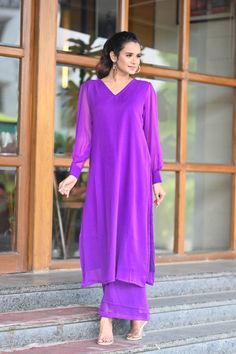 PRODUCT DESCRIPTION:-Let your personal style speak about your personality ,As you look absolutely gorgeous in our Purple Chiffone Co-Ord set.Kurta Fabric :- ChiffonPant Fabric :- ChiffonColor:-PurpleCare Instructions :- Dry clean onlyModel Size :- Model is wearing XS sizeModel Height :- 5.5''DISCLAIMER :- Slight color variations may occur due to different screen resolution. Elegant V-neck Sets For Festive Occasion, Summer Formal V-neck Sets, Chic Chiffon Long Sleeve Sets, Fitted Chiffon Set With Long Sleeves, Fitted Chiffon Long Sleeve Sets, Chic Long Sleeve Chiffon Set, Chiffon Long Sleeve Sets For Party, Elegant Summer Matching Palazzo Set, Elegant Summer Palazzo Matching Set