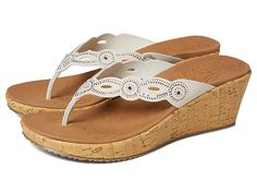 SKECHERS Beverlee - Happy Charmer - Women's Sandals : Off-White : Step out on the street with a chic look wearing the SKECHERS Beverlee - Happy Charmer sandals. Synthetic upper with allover rhinestone detailing. Textile and synthetic lining. Toe post silhouette. Wedge heels. Easy slip-on style. Synthetic outsole. Imported. Weight of footwear is based on a single item, not a pair. White Slip-resistant Sandals For Spring, Casual Sandals With Perforations In Synthetic Material, Casual Synthetic Sandals With Perforations, Casual Sandals With Perforations, Skechers Kids, Chic Look, Tick Tock, Color Rojo, Cute Charms