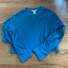 Never Worn. Excellent Condition. Like New M/ 8-10 Smoke Free/Pet Free Home Spring Blue Cotton Activewear, Light Blue Athleisure Top For Loungewear, Light Blue Relaxed Fit Sporty Top, Sporty Light Blue Tops For Loungewear, Comfortable Blue Long Sleeve Tops, Blue Long Sleeve Comfortable Tops, Comfortable Long Sleeve Blue Tops, Basic Blue Cotton Activewear, Blue Stretch Casual Sweatshirt