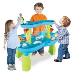 two young children playing with an inflatable water table