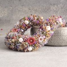 a close up of a wreath made out of beads