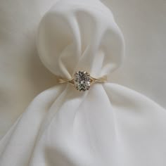 a white cloth with a ring on it