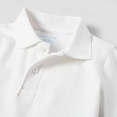 Help your child get ready for a great day at preschool with a great look with the Long-Sleeve Interlock Uniform Polo Shirt from Cat & Jack™. This elegantly simple uniform shirt comes in a white color that matches perfectly with just about any uniform bottoms. The long sleeves help keep them warmer in cooler temps, and the collared neckline adds a neat, tidy look. This shirt falls below the waist and can tucked in or left untucked, plus, the regular fit provides all-day comfortable wear. Cat & Ja Basic White Polo Collar Top, White Polo Collar Basic Top, White Collared Top For School, Fitted Long Sleeve White Polo Shirt, White Fitted Long-sleeve Polo Shirt, Basic White Collared Polo Shirt, Classic Long Sleeve Tops For School, Basic White Collared Shirt, White Collared Basic Shirt