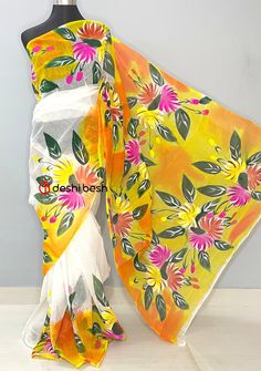 This Hand Painted Mixed Cotton Saree is perfect for your everyday and occasional use. Mixed Cotton Saree. All Over Floral Hand Painted Work. No Blouse Piece. Color: There might be slight color variation due to lighting and flashes while the photo shooting. The color may also vary because of different screen resolutions. Wash Care: Wash with cold water. Traditional White Saree For Spring, Orange Summer Saree, White Cotton Saree For Summer, Spring Festive White Saree, Festive Multicolor Saree For Spring, White Summer Saree With Pallu, Summer White Saree With Pallu Detail, Festive Multicolor Spring Saree, White Festive Saree For Summer