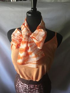 "This scarf was hand dyed using the Shibori dye method The scarf measures about 58\" long x 15\" wide and is made of 100% cotton.  It is an excellent accessory for an outfit and is great to use as a splash of color. Hand wash the scarf it to keep it vibrant and bright.  Line or machine dry." Bohemian Hand Dyed Scarves For Summer, Bohemian Hand-dyed Scarves For Summer, Casual Orange Summer Scarf, Bohemian Hand Dyed Spring Scarves, Bohemian Hand Dyed Scarves For Spring, Bohemian Hand Dyed Cotton Scarves, Bohemian Hand-dyed Scarves For Spring, Bohemian Hand-dyed Cotton Scarves, Bohemian Hand Dyed Cotton Scarf