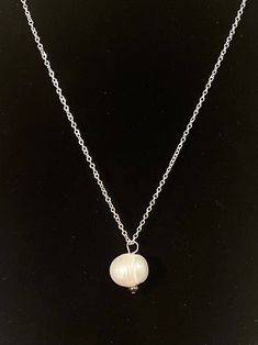 "This large, single and gorgeous freshwater pearl is accented with a tiny grey freshwater pearl. It is on a 925 silver chain. This necklace has a matching pair of earrings - listed in my shop separately. All of my pearls are natural and unique The Golden Rule of Pearl care: \"Last thing on, first thing off.\" Pearls are more vulnerable to the chemicals found in cosmetics, hair products harsh cleaners and perfume. Pearls do not like chlorine in swimming pools or showers." The Golden Rule, Freshwater Pearl Necklace, Golden Rule, Freshwater Pearl Necklaces, Hair Products, The Golden, Freshwater Pearls, Silver Chain, Swimming Pools