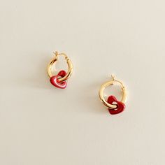 Discover timeless and preppy curated and handmade jewelry gifts for your loved ones at ALYSIUMco.  ITEM DESCRIPTION: The Earring: ∙  .925 Sterling Silver  ∙  18k Gold Plated ∙  Diameter 1 inch The Heart: ∙  Resin ∙  Red Heart   SHIPPING & RETURN POLICY: ∙  Free standard shipping on orders above $35 ∙  Please allow 2-3 business days for processing and shipping ∙  All merchandise is final sale, unfortunately, we do not accept any returns or exchanges Waterproof White Flower Hoop Earrings, .925 Ste Trendy Small Hoop Jewelry For Valentine's Day, Trendy Small Hoop Heart Earrings As Gift, Small Hoop Tarnish-resistant Jewelry For Valentine's Day, Small Hoop Tarnish Resistant Jewelry For Valentine's Day, Small Hoop Earrings For Anniversary On Valentine's Day, Valentine's Day Tarnish-resistant Small Hoop Jewelry, Valentine's Day Small Hoop Pierced Earrings, Trendy Huggie Jewelry For Valentine's Day, Valentine's Day Tarnish-resistant Hoop Earrings