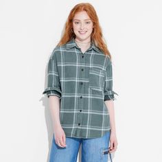 Flannel button-down shirt from Wild Fable™ with a plaid pattern. Made from lightweight cotton. Designed in an oversized fit with a collared neckline, full front button-down closure, chest patch pocket and long sleeves with buttoned cuffs. Tunic-length shirttail hem completes the stylish look. If you're not satisfied with any Target Owned Brand item, return it within one year with a receipt for an exchange or a refund. Wild Fable™: A look for every story. Oversized Plaid Tops For Everyday, Green Relaxed Fit Button-up Flannel Shirt, Oversized Plaid Flannel Shirt Casual, Casual Plaid Top With Shirttail Hem, Oversized Plaid Top For Daywear, Oversized Spring Button-up Flannel Shirt, Oversized Button-up Flannel Shirt For Spring, Plaid Flannel Shirt For Everyday Spring Wear, Oversized Casual Flannel Shirt