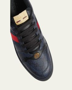 Gucci "Screener" 70sinspired lowtop sneakers in GG Supreme canvas and leather    Features blue and red web stripes on the sides    Flat heel    Round toe    GG logo detail    Laceup vamp    Tongue with label    Fabric lining    Padded collar    Leather backstay with logo    Rubber outsole    Made in Italy Gucci Screener, Red Web, Gg Logo, Gucci Men, Low Top, Top Sneakers, Dark Blue, Tops Designs, Stripes