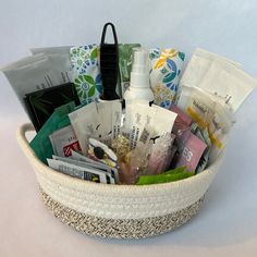 a basket filled with lots of different types of personal care products and items in it