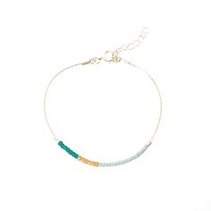 Our handmade Dusk Bracelet, lovingly crafted in our Texas studio, is part of the Desert Sunset collection. This understated modern piece draws inspiration from the breathtaking colors that grace the desert sky at dusk. We meticulously handcraft each piece with utmost care and attention to detail. Using a delicate blend of hand-beaded Japanese glass beads, we carefully selected colors that reflect the serene hues of the desert sunset. The result is a mesmerizing pattern that evokes a sense of tra Minimalist Hand-strung 14k Gold Filled Bracelet, Hand-strung Minimalist 14k Gold-filled Bracelet, Modern Hand-strung Jewelry For Everyday, Modern Hand-strung Jewelry For Gifts, Modern Hand-strung Everyday Jewelry, Handmade 14k Gold Filled Bohemian Bracelet, Handmade 14k Gold-filled Bohemian Bracelet, Handmade Bohemian 14k Gold-filled Bracelet, Modern Jewelry With Tiny Beads