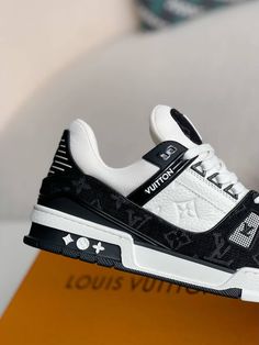 Embrace iconic style with a contemporary twist in these Louis Vuitton Trainer-inspired sneakers. The classic low-top silhouette is reimagined with a stylish black and white denim upper, adorned with the signature Louis Vuitton monogram pattern. The clean lines and chunky sole create a versatile look that's perfect for everyday wear, while the subtle branding adds a touch of understated luxury. Your order arrives in a branded shoe box, complete with dust bags, extra laces, socks, a care booklet, Louis Vuitton Trainers, Fall Winter Jacket, Understated Luxury, Monogram Pattern, Loafer Sneakers, Bottega Veneta Shoulder Bag, Iconic Style, White Denim, Key Holder