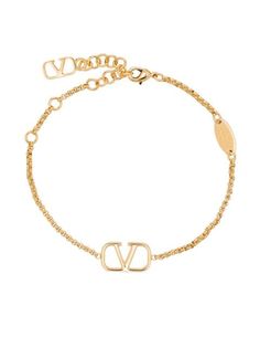 Shop Valentino Garavani VLogo chain bracelet with Express Delivery - FARFETCH Designer Gold-tone Metal Jewelry, Luxury Gold Jewelry With Logo Charm, Designer Gold Jewelry With Adjustable Chain, Gold-tone Metal Jewelry With Logo Plaque, Luxury Gold-plated Jewelry With Gold-tone Logo, Luxury Gold Jewelry With Gold-tone Logo Plaque, Yellow Gold Metal Jewelry With Gold-tone Logo, Elegant Gold Jewelry With Logo Charm, Designer Gold Bracelets With Logo Charm