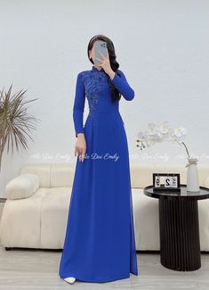 🌻Material: chiffon. 🌻Stretchy level: 3/10 🌻 The measurement of this ao dai (long dress) is in Vietnamese size (American size tends to be bigger for the same size). Please LOOK AT THE SIZE CHART CAREFULLY BEFORE ORDERING. There might have some chalk writings on the fabric due to making process. These marks can be washed away easily. 🌻🌻No returns or exchanges Buyer can contact seller about any issues with an order. 🌸 Follow us Facebook/aodaiemily www.aodaiemily.com 💜 Thank you very much!💜 Elegant Long Dresses For Ceremony, Elegant Georgette Gown For Banquet, Fitted Blue Cheongsam For Wedding, Elegant Evening Blue Ao Dai, Elegant Long Sleeve Formal Cheongsam, Elegant Formal Long Sleeve Cheongsam, Elegant Blue Ao Dai For Formal Occasions, Elegant Blue Fitted Ao Dai, Elegant Blue Gown For Ceremony