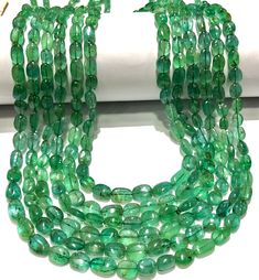 ~~ with traditional adjustable chord~~  ~~6 strand layered necklace~~ gemstone  ----  emerald shape          ----  nuggets width          ----   5-6.5 mm height           6-9  strands       6 layerd necklace length       ----   17-18-19-20-21 inch long texture        smooth colour        green grade            aaa+ beautiful green emerald 6 layer necklace  100% satisfaction guaranteed  wholesale shop//wholesale price  amazing smooth emerald stone beads emerald gemstone smooth nuggets shape beads Layerd Necklace, Emerald Beads Necklace, Emerald Bead, Zambian Emerald, Necklace Gemstone, Emerald Stone, Emerald Gemstone, Green Emerald, Natural Emerald