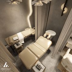 an aerial view of a spa room with chairs, tables and lamps on the walls