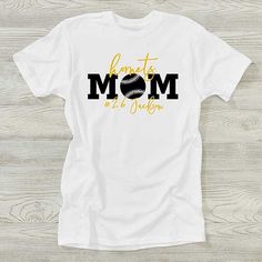 Personalize with sport, 1 line of text above and 1 line of text below "mom"Choose from multiple color combinations   Our Sports Mom Personalized Ladies Shirts will clearly state that she is your #1 fan as she watches you play your favorite sport. Sporty Crew Neck T-shirt For Mother's Day, Sporty Graphic Print T-shirt For Mother's Day, White Sporty T-shirt For Mother's Day, Sporty White T-shirt For Mother's Day, Mother's Day Sports T-shirt With Letter Print, Ladies Shirts, Sports Mom, Ladies T Shirt, Multiple Color