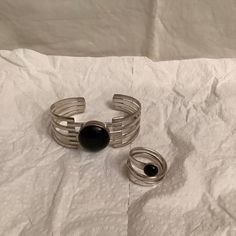 Ddd Stamped Mexico 925 Sterling Silver Black Onyx Inlay Cuff Bracelet + Ring 8.5. Both Pieces Are New Without Tags Here We Have A 2 Pieces Set Of Bracelet/ Bangle With Ring By: Dominique Dinouart Both Pieces Are Marked Ddd 925 Mexico. The Ring Is Size 8.5 I Think It Could Be Adjustable. Both Item Has Black Nix Stone. Very Pretty Set Impossible To Find Together And For Sure It Will Complement Any Outfit. See Pictures As Part Of Description. Black Metal Minimalist Cuff Bracelet, Black Minimalist Metal Cuff Bracelet, Minimalist Black Metal Cuff Bracelet, Modern Silver Open Ring Bracelet, Black Sterling Silver Bangle, Sterling Silver Open Ring Bracelets, Adjustable Black Cuff Bracelet With Polished Finish, Nickel-free Black Open Ring Jewelry, Nickel-free Black Open Ring