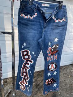 A hand painted customized pair of Jeans  For birthdays, vacations, bachelorette parties, weddings, graduation or school spirit days. You can discuss your specific requests with me and send pictures of anything I can use to help bring ur ideas to life  You will purchase this listing for the painting.  After that you need to message me to get my address where you will mail me the jeans.  The fabric paint I use indicates that is it safe for machine washing. I can not be responsible for any damage, fading or peeling. I recommended cleaning as needed with cool water and damping a wash cloth for spot cleaning Diy Painted Jeans Ideas, Painted Pants School Spirit, Painted Jeans Senior, Painting Pants Ideas, Homecoming Jeans Decorated, School Spirit Jeans, Homecoming Jeans Painted, Painted Jeans School Spirit, Spirit Jeans Ideas