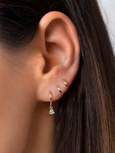 "Delicate huggie hoop earrings with a tiny prong-set white cubic zirconia drop charm. Understated and elegant, these dainty hoops will mix and match effortlessly with other earrings and are perfect for everyday wear. * D E T A I L S * ∙ Sold individually (1 earring) or by pair (2 earrings) ∙ Material: .925 Sterling Silver or 18K Gold Plated over .925 Sterling Silver ∙ Stone: White Zirconia ∙ Dimensions: Hoop diameter: 11mm // Zirconia: 3mm ∙ Hypoallergenic & nickel-free * P A C K A G I N G * Gold Cartilage Earrings, Second Hole Earrings, Dainty Hoop Earrings, Tiny Hoop Earrings, Dainty Studs, Mini Hoop Earrings, Tiny Earrings, Diamond Charm, Huggie Earrings