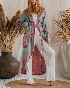 Designed with a loose and flowing silhouette, our Original Bamboo Modal Kaftan drapes gracefully on the body, providing a relaxed and flattering fit. The harmonious combination of these hues creates a visually stunning garment that can be dressed up or down for any occasion. Made from sustainable bamboo, this kaftan is not only gentle on your skin but also gentle on the planet. Bamboo is a fast-growing and renewable resource, making it an eco-conscious choice for those who value sustainability. Pair our Original Bamboo Modal Kaftan with our wide pants for a coordinated and chic ensemble. Experience the ultimate blend of style, comfort, and eco-friendliness with our captivating Original Bamboo Modal Kaftan. Size: Our model has the following measurements: Height: 174 cm | 5 ft 9 inchesChest: Fitted Kimono For Spring Loungewear, Bohemian Floor-length Kimono For Spring, Summer Bohemian Floor-length Kimono, Bohemian Floor-length Spring Kimono, Spring Bohemian Floor-length Kimono, Silk Fitted Robe For Spring, Flowy Kimono For Daywear, Fitted Wrap Kimono For Spring, Spring Fitted Wrap Kimono