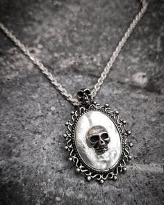 "Victorian Skull White Opal Steampunk Gothic Oxidized Sterling Silver 925 Pendant Necklace on Chain Our beautiful Gothic White Opal Skull Necklace is the perfect finishing touch to your gothic wedding gown. White Opal Skull Gothic pendant will be a hit with your horror-loving friends or anyone who loved a more dark style of jewelry. This is an excellent unique gift for anyone who enjoys Skulls, Halloween, Rockabilly style, Gothic Style, or unique horror artwork. This necklace can be worn with an White Goth, Sea Necklace, Gothic Pendant, Horror Artwork, Biker Jewelry, Rockabilly Fashion, Cameo Necklace, Skull Necklace, Gothic Jewelry