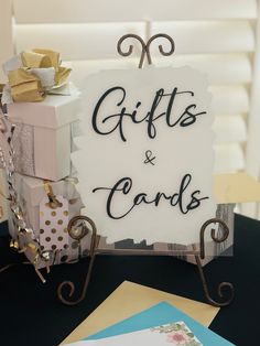 a sign that says gifts and cards on it