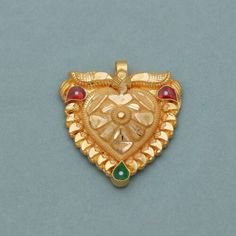 Temple Jewelry As A Gift, Gold Gemstone Jewelry As Gift, Gold Gemstone Jewelry Gift, Festival Gemstone Jewelry Gift, Traditional Gold Jewelry As A Gift, Traditional Gold Jewelry For Gift, Heart Pendant Amulet Jewelry Gift, Traditional Silver Heart Pendant Jewelry, Traditional Heart-shaped Jewelry For Festive Occasions