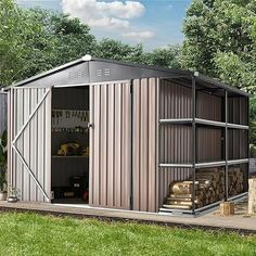 a metal shed sitting on top of a lush green field