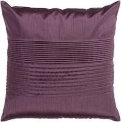 a purple pillow with pleated lines on the front and back, sitting against a white background