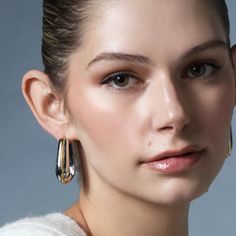 Create a striking look that commands the room with the Queen Ravenna Statement Hoops. Crafted in 925 sterling silver with 18K gold vermeil detailing, these hoops were made for the woman with an eye for opulence. Adorn yourself with these hoops and take on the world with enchanting royal elegance. Modern Pierced Hoop Earrings For Evening, Luxury Polished Finish Hoop Earrings, Luxury Polished Hoop Earrings, Luxury Hoop Earrings For Evening, Luxury White Gold Hoop Earrings With Shiny Finish, Classic Polished Hoop Earrings For Evening, Luxury Shiny Finish Hoop Earrings For Formal Occasions, Chic Silver Hoop Earrings Tarnish Resistant, Luxury Metal Hoop Earrings For Formal Occasions