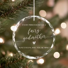 an ornament hanging from a christmas tree with the words, every princess needs a fairy godmoter