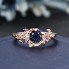 Nature Inspired Round Galaxy Blue Sandstone Amethyst Wedding Ring Unique Moon Leaf Vine Blue Goldstone Engagement Ring Art Deco Promise Ring Engagement Ring: round cut alexandrite The side stones are amethyst and moissanite Material Metal: 925 sterling silver, Solid 10k/14k/18k gold,platinum This jewelry is made to order, it can be made with any gemstone/metals. 2-3 weeks to finish. Default Shipping method is usps. 30 days non-hassle return policy.For returned items,there may be handcrafting and Gemstone Wedding Rings Brilliant Earth, Luxury Gemstones For Promise Rings, Luxury Multi-stone Crystal Promise Ring, Nature Inspired Wedding Ring Alexandrite, Cheap Crystal Promise Ring With Diamond Accents, Luxury Crystal Promise Ring With Stones, Luxury Gemstone Stackable Rings For Promise, Luxury Celestial Diamond Promise Ring, Luxury Celestial Moonstone Ring For Anniversary