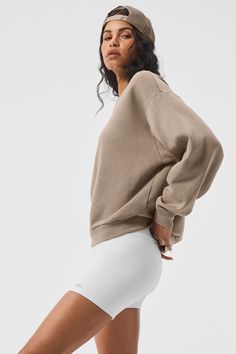 This best seller is cozy, comfortable, cute and done in classic neutrals and on-trend colors—each finished with a chrome Alo logo. It has a classic crewneck, ribbed cuffs and hem, and a laid-back dropped-shoulder fit. It’s made from midweight French terry that’s smooth on the outside and fleecy on the inside with the perfect drape. Pair with the Accolade sweatpants to make a matching set—and get one for your bestie, sibling, or partner, if you’re into that. Find your fit and see all the ways to The Accolade, Gray Accessories, Fabric Sale, Kendall + Kylie, Sweaters Knitwear, Short Shirts, Alo Yoga, Sport Shorts, Color Trends